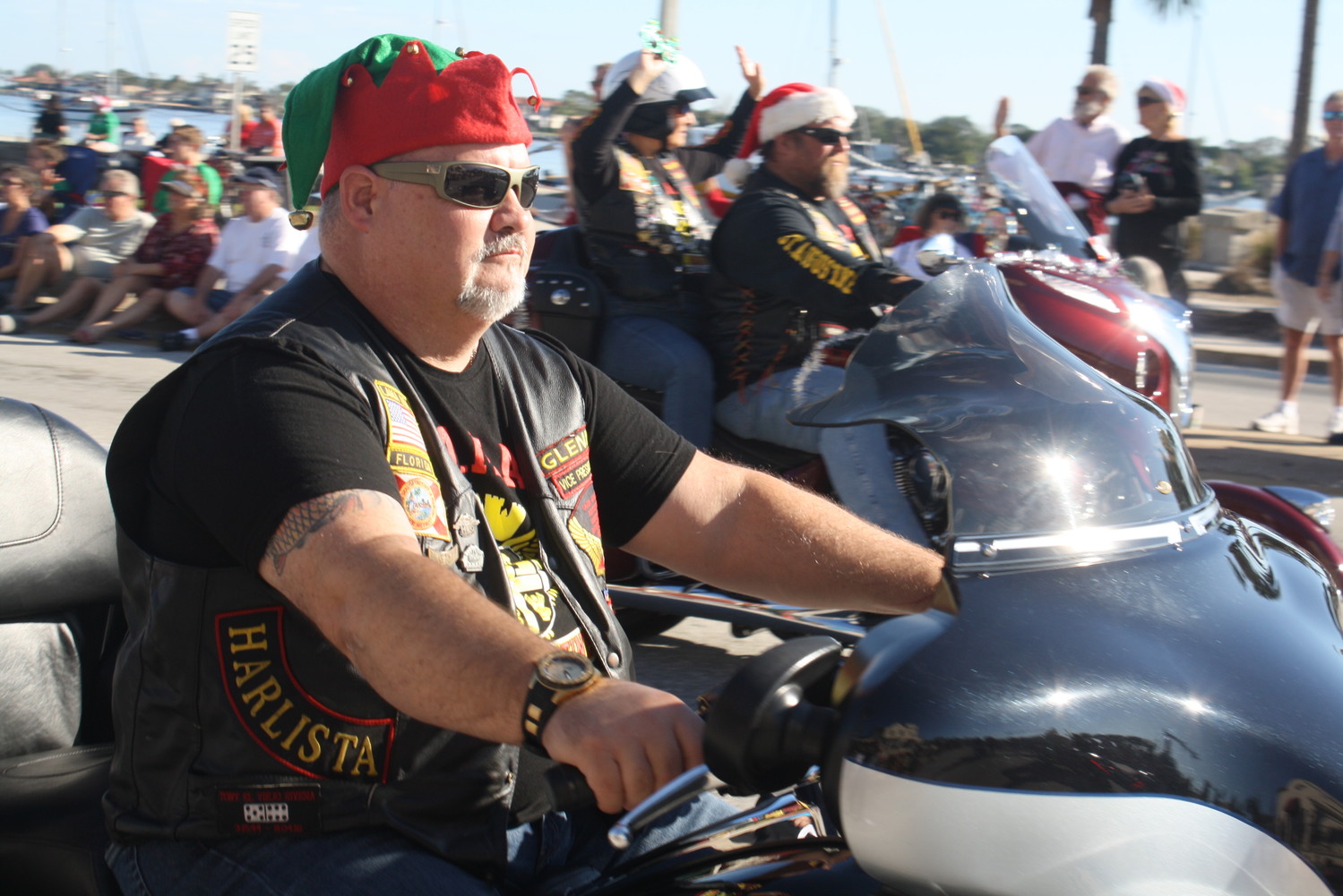 A motorcyclist takes part in the holiday cheer of the St. Augustine Christmas parade.