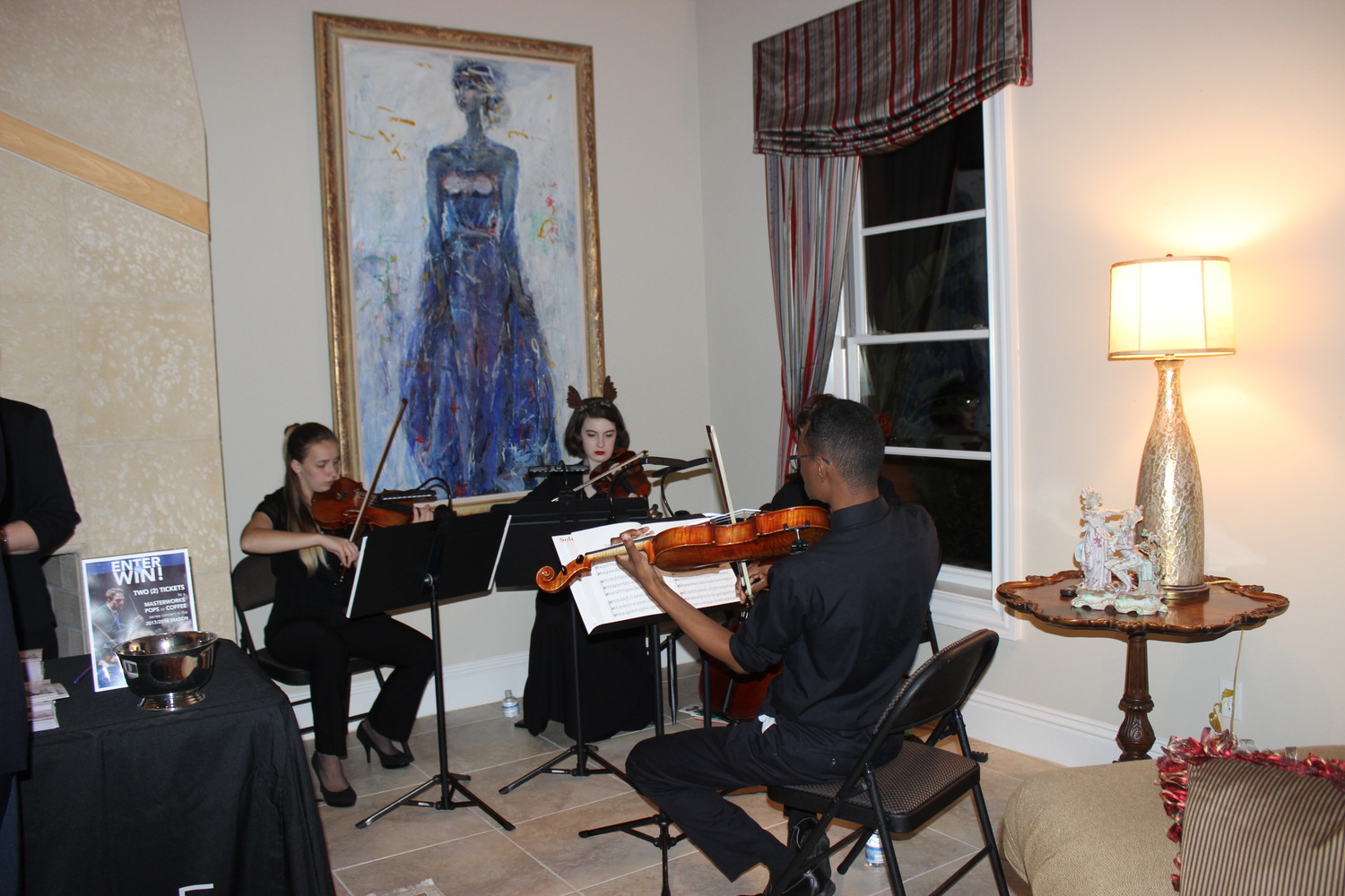 The Jacksonville Symphony Youth Orchestras provide entertainment at the holiday party.
