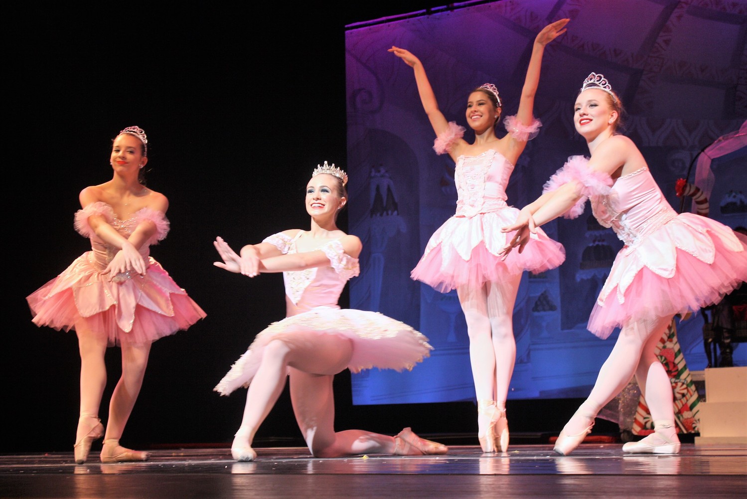 Sugar Plums surround the Sugar Plum Fairy, portrayed by Jordan Polster (center left).