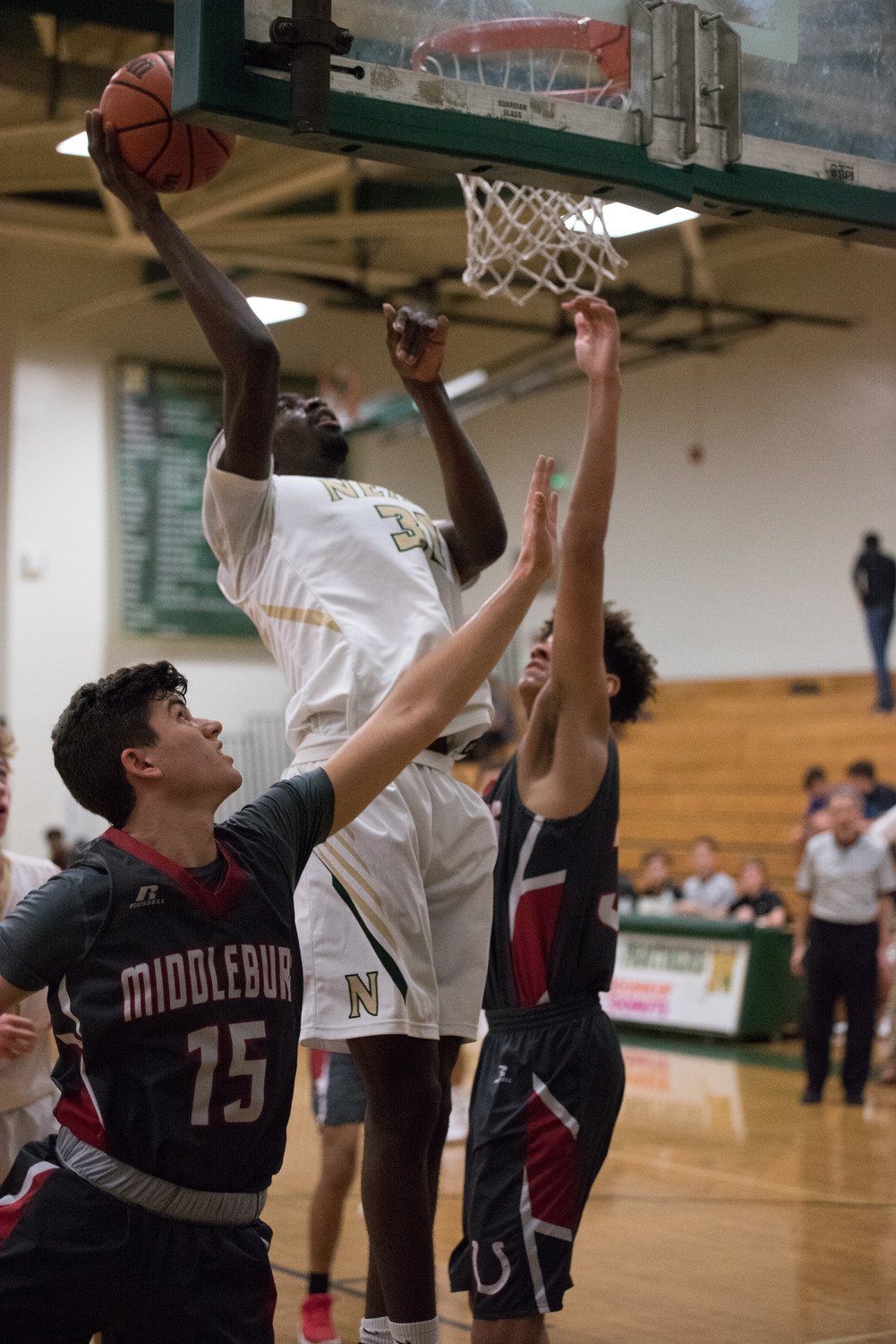 Nease's Aaron Cochran drives to the basket during a district 3-7A matchup against Middleburg. Cochran scored 14 points in the win.