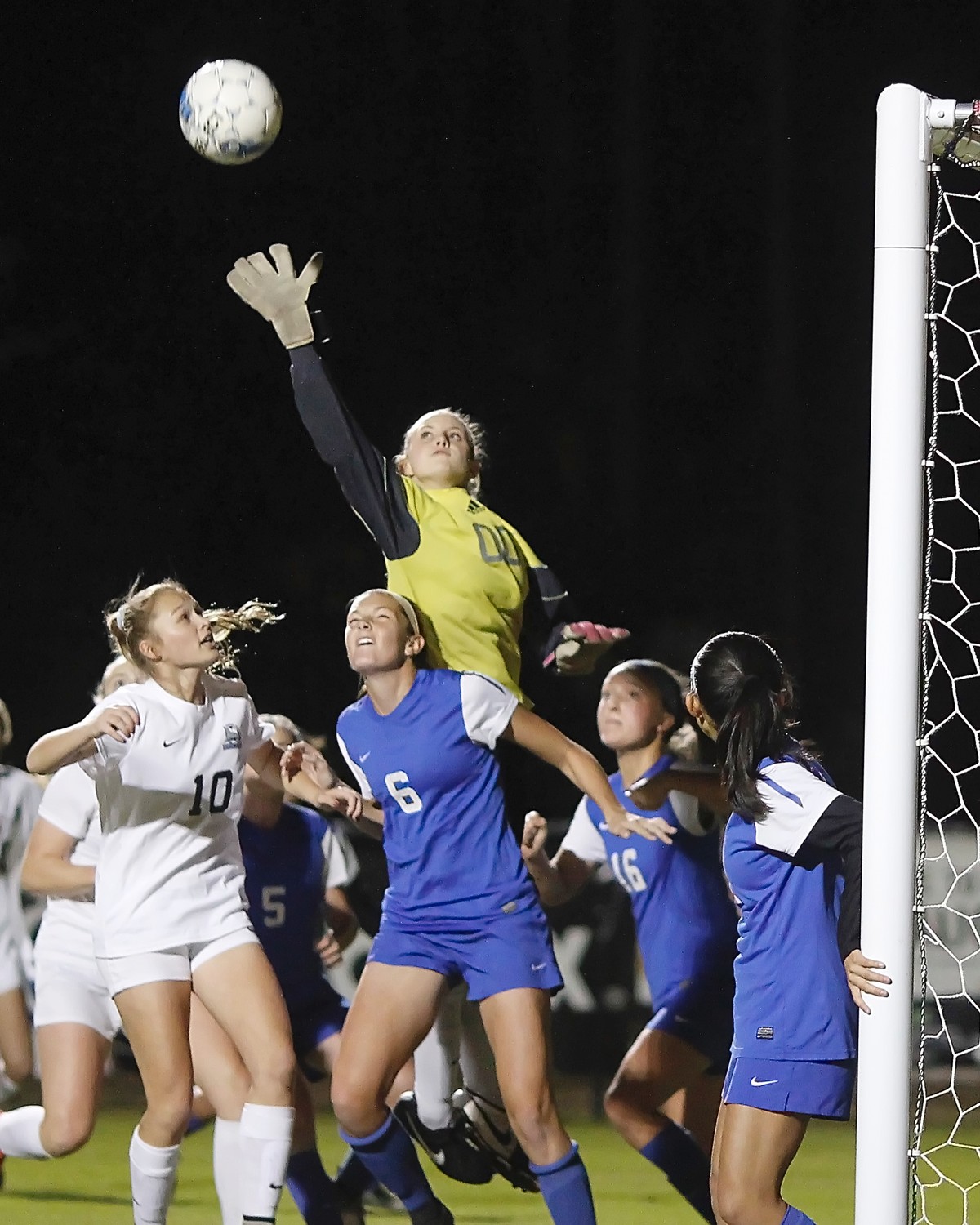 The Clay goalkeeper leaps high to make a save.