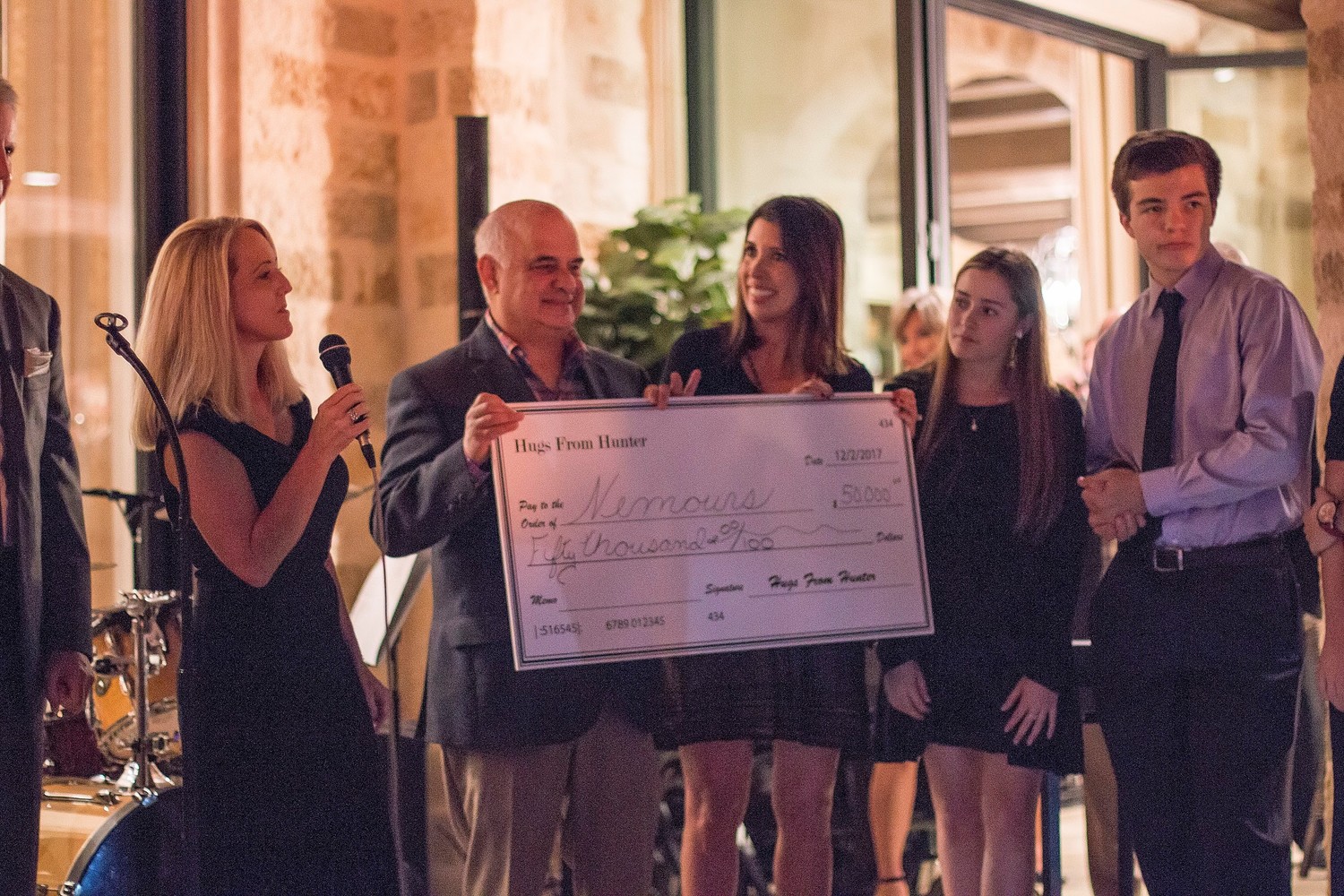 Event organizers participate in a $50,000 check presentation from the Hugs from Hunter Foundation to Nemours Children’s Specialty Care.