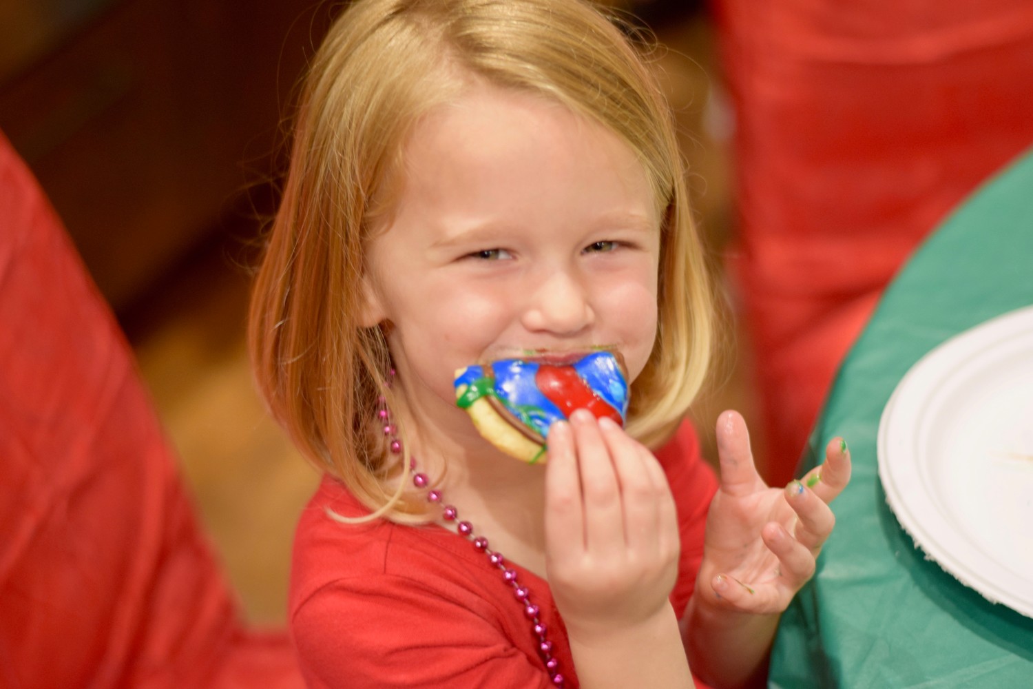 Children celebrate the holidays by decorating cookies at Shearwater’s Winter Festival.