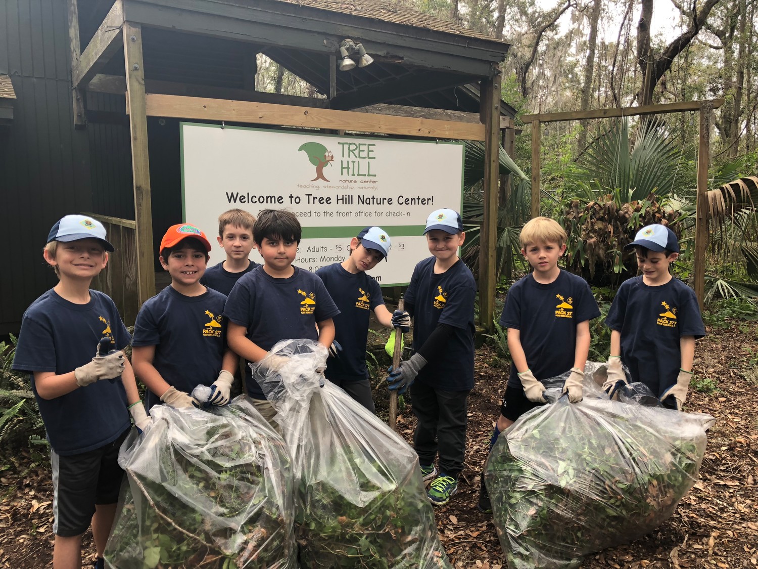 Spencer York (from left), Jackson Bohsali, Forrest Lindow, Ryan Tawk, Seth Dowling, Austin Barber, Carter Stoltz and Conner Dunning of Cub Scouts Pack 277 (Ponte Vedra Beach) complete a community service project at Tree Hill Nature Center in Jacksonville. The boys pulled weeds and cleaned up the entrance to the nature center on Jan. 27.