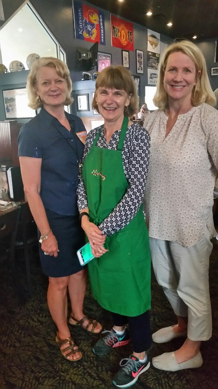 Jeanette Edwards, Cathy Stupski and Lynn Wilkinson from The Bolles School serve as "celebrity waiters" in 2017.