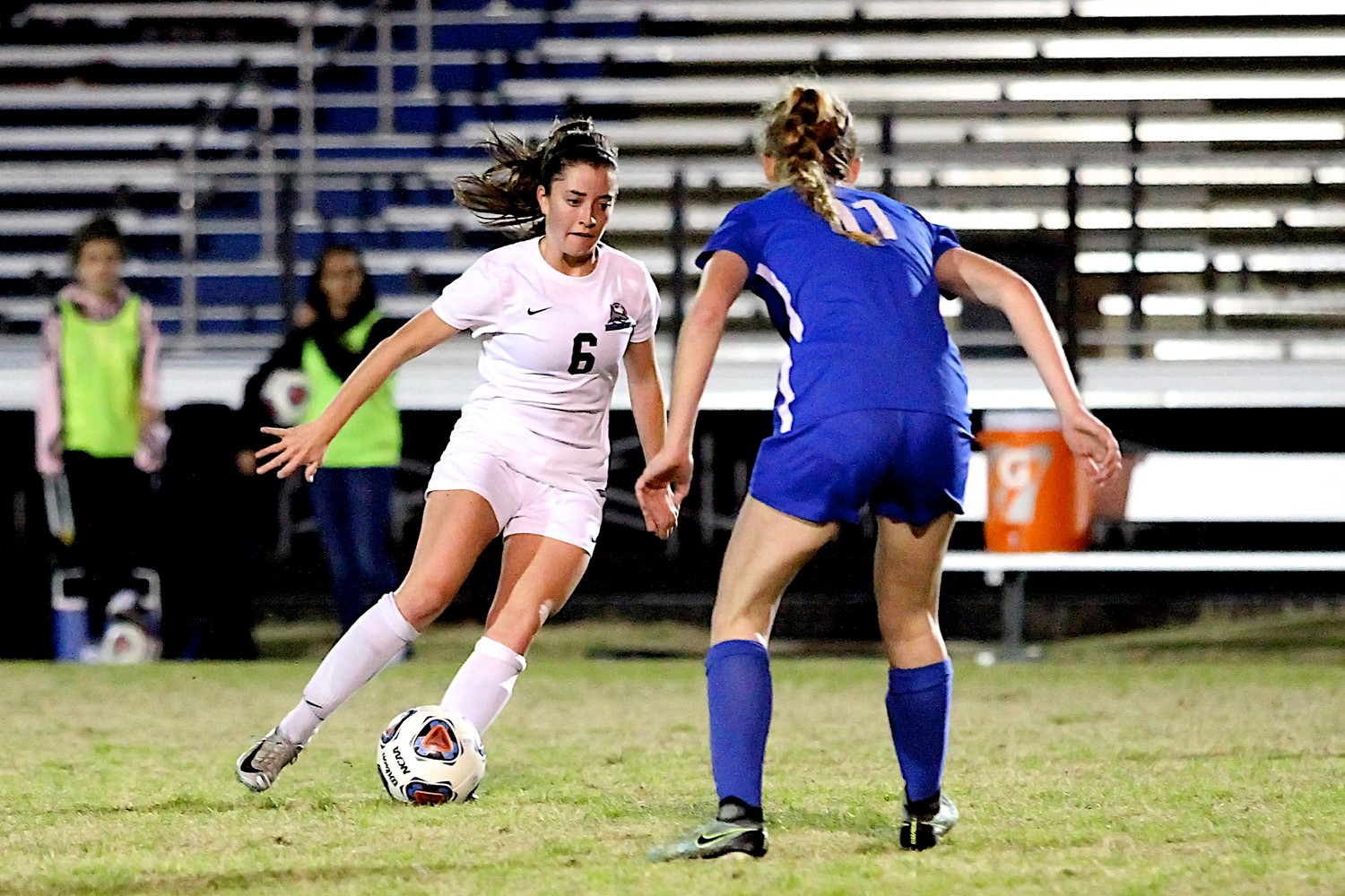 Molly Miler of the Sharks moves the ball past a Pedro defender.