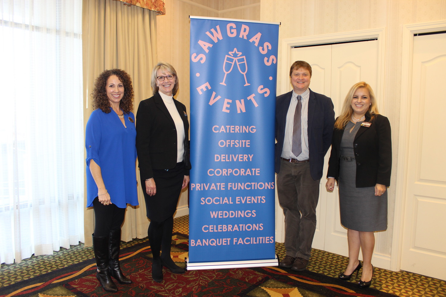 Hilton Garden Inn employees Anna Washington, Carol Mauer, Ted Hayes and Anette Saalmann share the news about the formation of Sawgrass Events at a recent tasting event.
