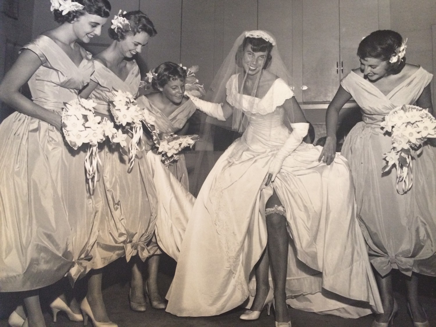 Jennie Veal’s bridesmaids admire her dress.