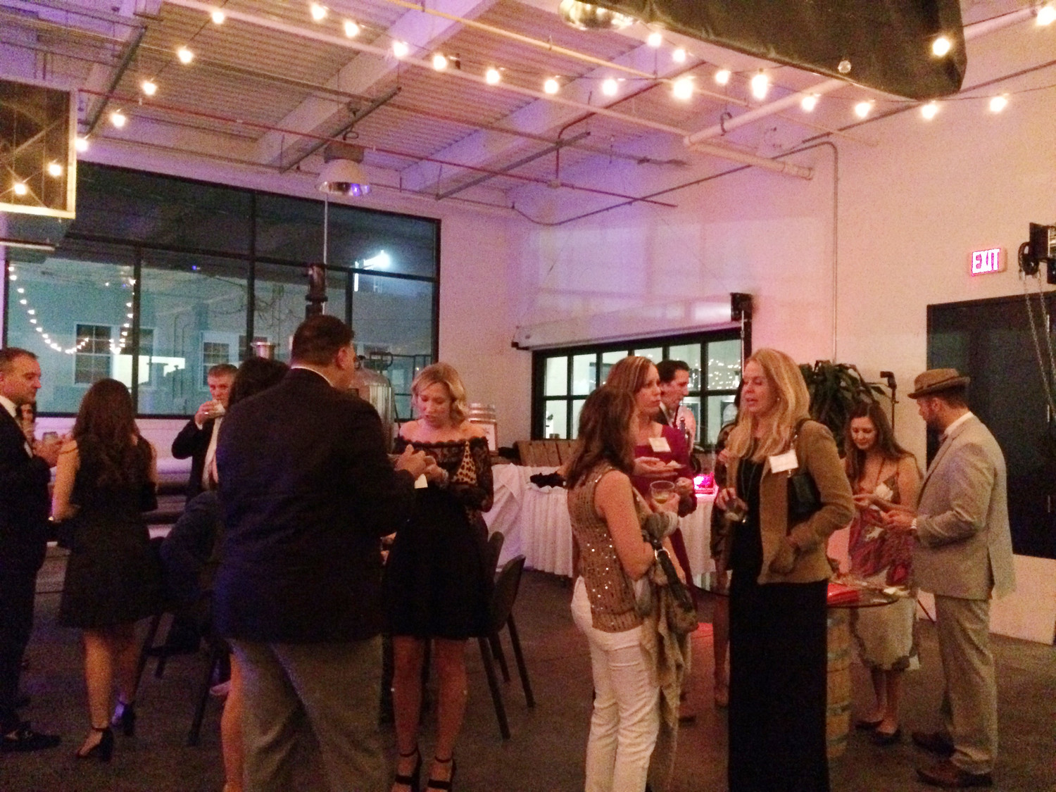 Guests enjoy the inaugural Bowtie Ball event at Manifest Distilling in Jacksonville.