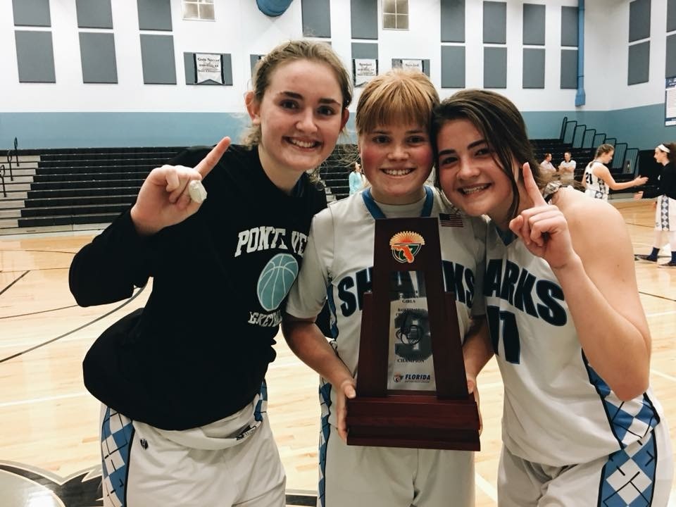 Leah McCarthy, Channing Chappell and Tess Tibbits celebrate Ponte Vedra’s district title after the Sharks defeated Pedro Menendez 58-40 on Friday, Feb. 9.