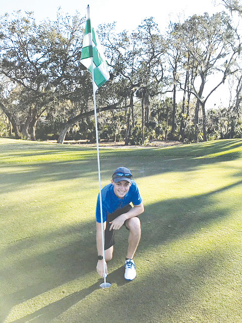 Matthew Quintal celebrates making a hole-in-one at No. 8 at Oak Bridge Club on Sunday, Feb. 17. Quintal played with clubs that once belonged to his uncle, who recently passed away due to cancer. Quintal and his uncle frequently played golf together before his passing.