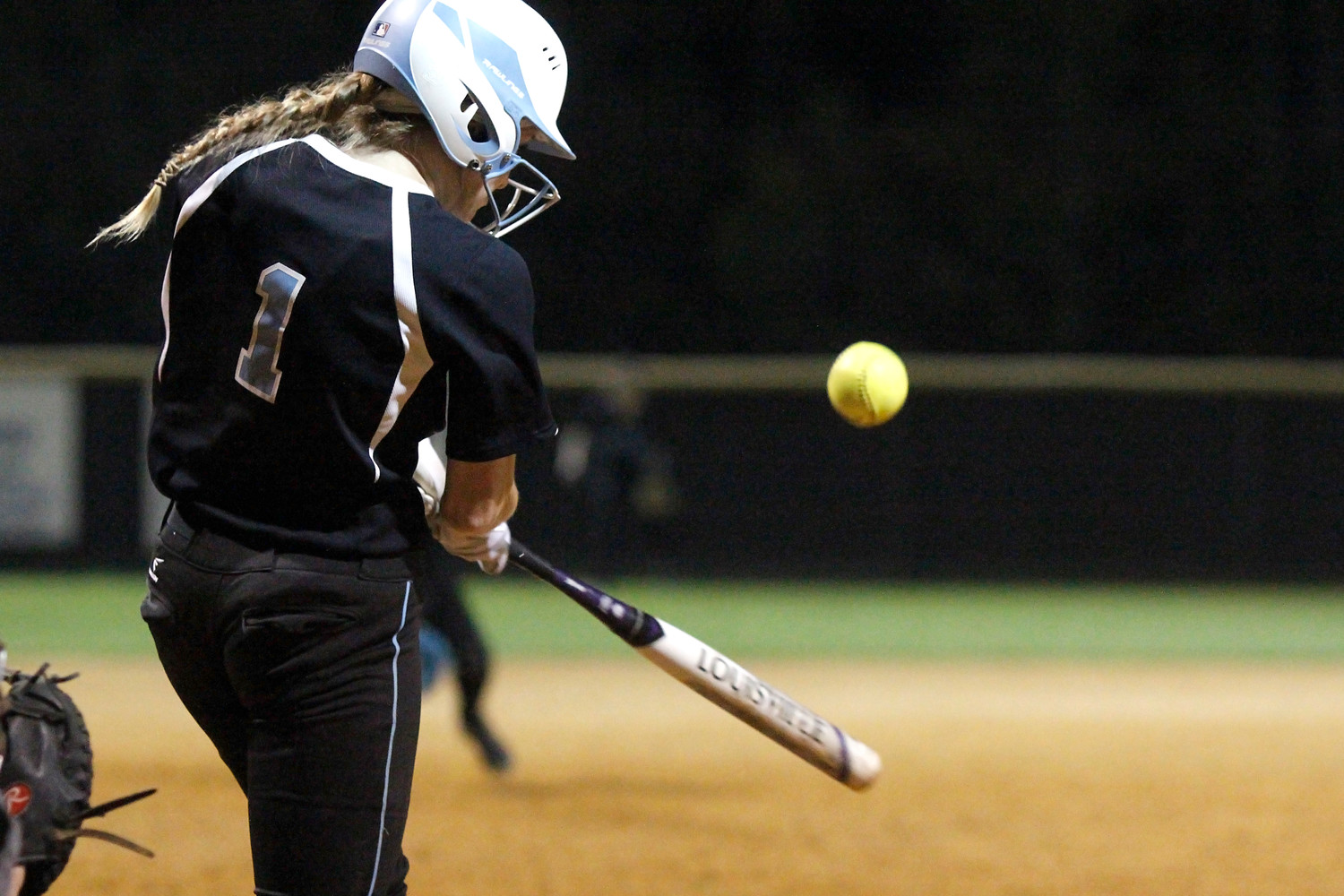 Bailey Wagoner (1) delivers a base hit to the left, one of just two hits by 
the Sharks.