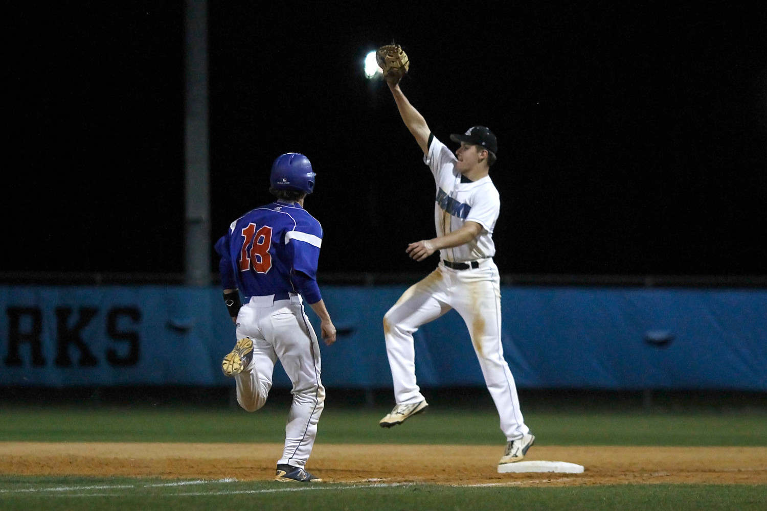Sharks first baseman Tony Roca stretches high to retire the Bolles batter.