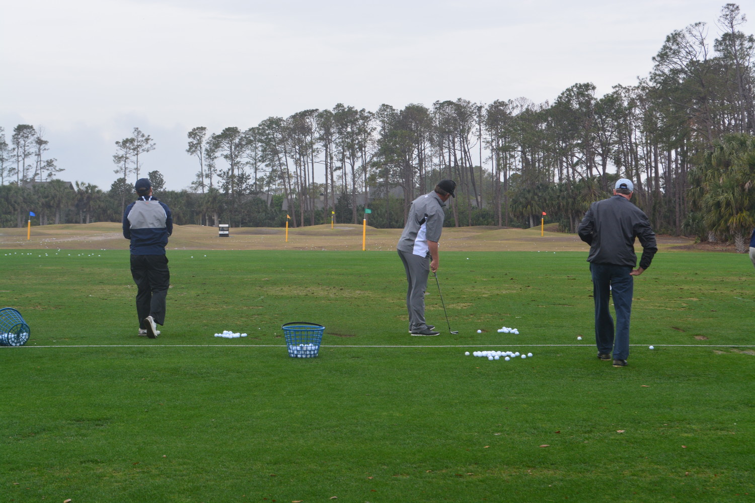 Furyk & Friends Concert & Celebrity Golf Classic participants practice their swing prior to the start of the tournament.