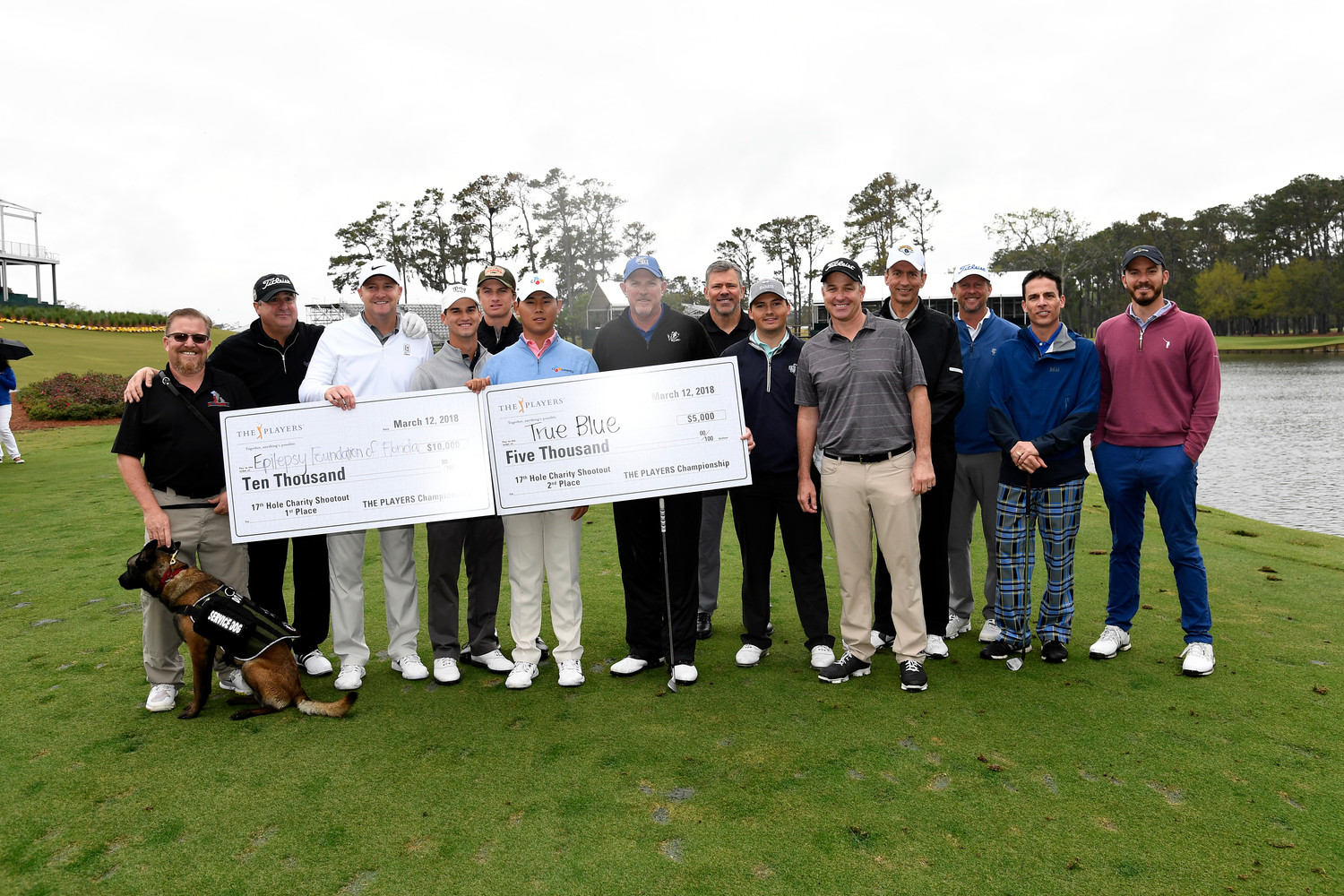 The Charity Challenge participants gather with Si Woo Kim after the event to display the donations to the Epilepsy Foundation of Florida and True Blue.