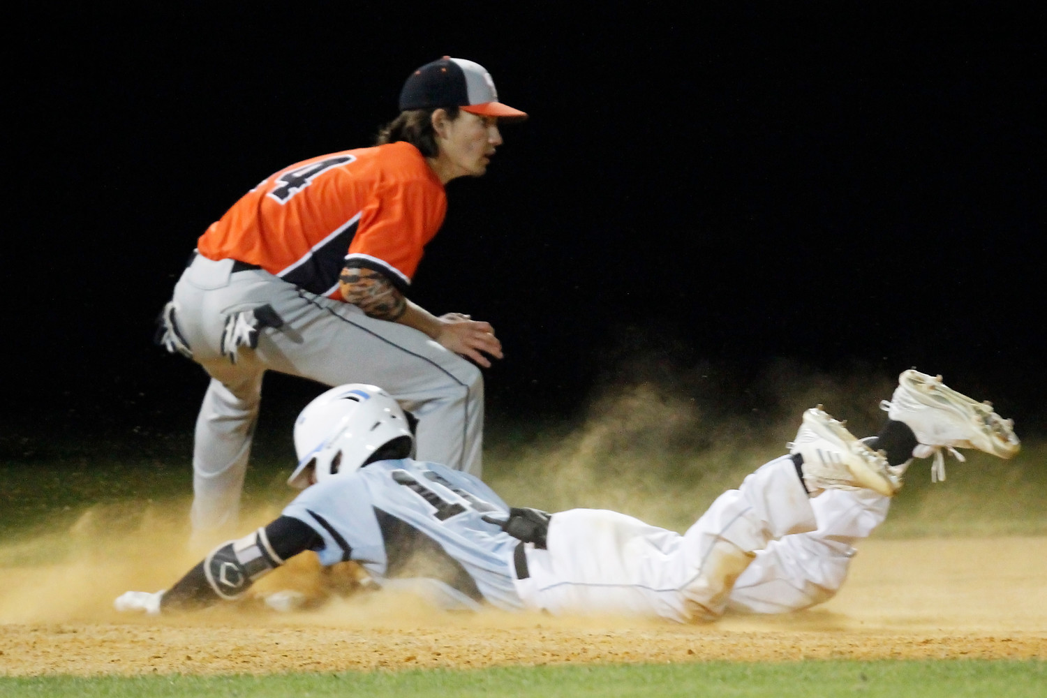 Ponte Vedra’s Jacob Young (11) slides safely into third in a cloud of dust against Orange Park.