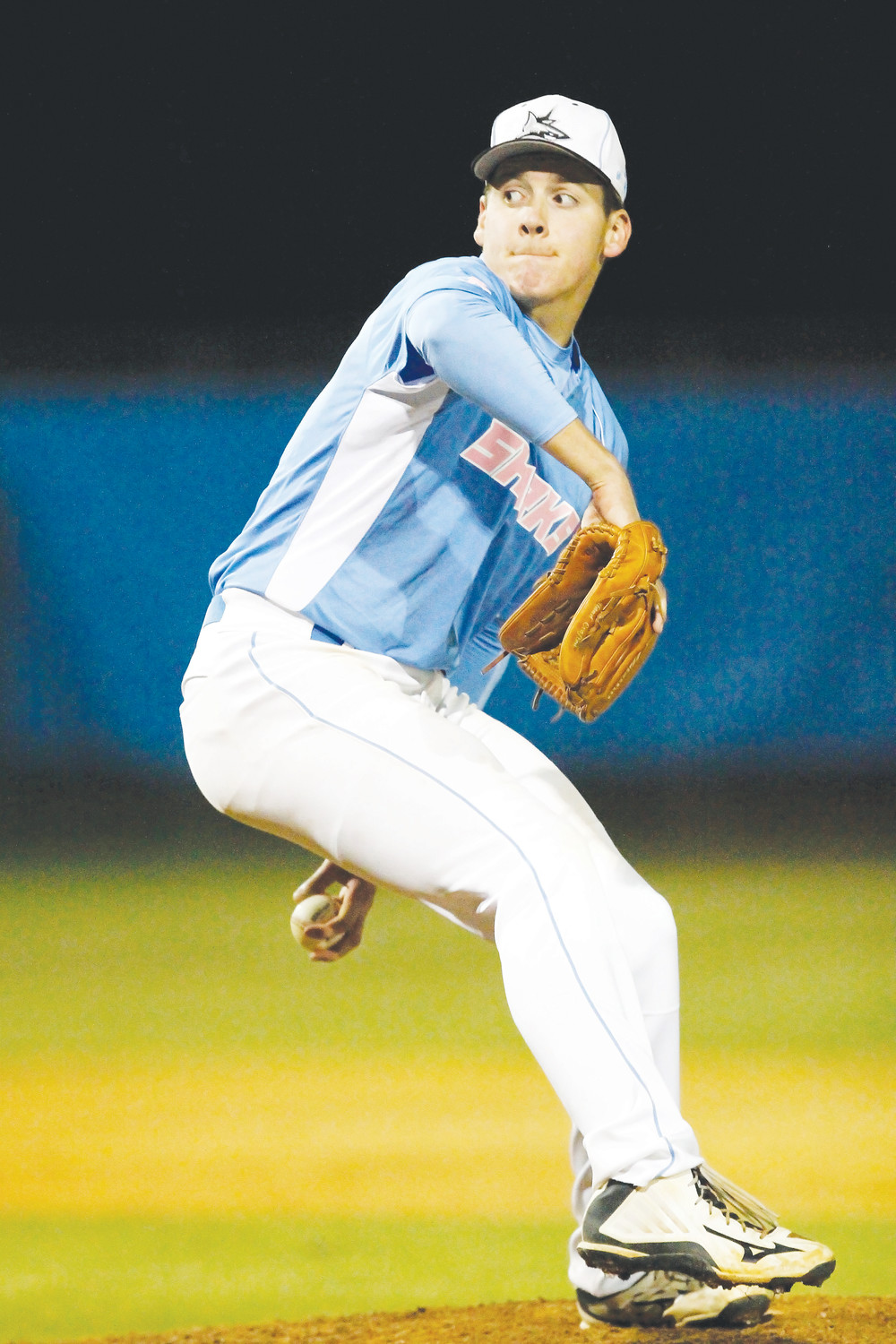 Shark pitcher Tony Roca delivers a pitch against Episcopal.