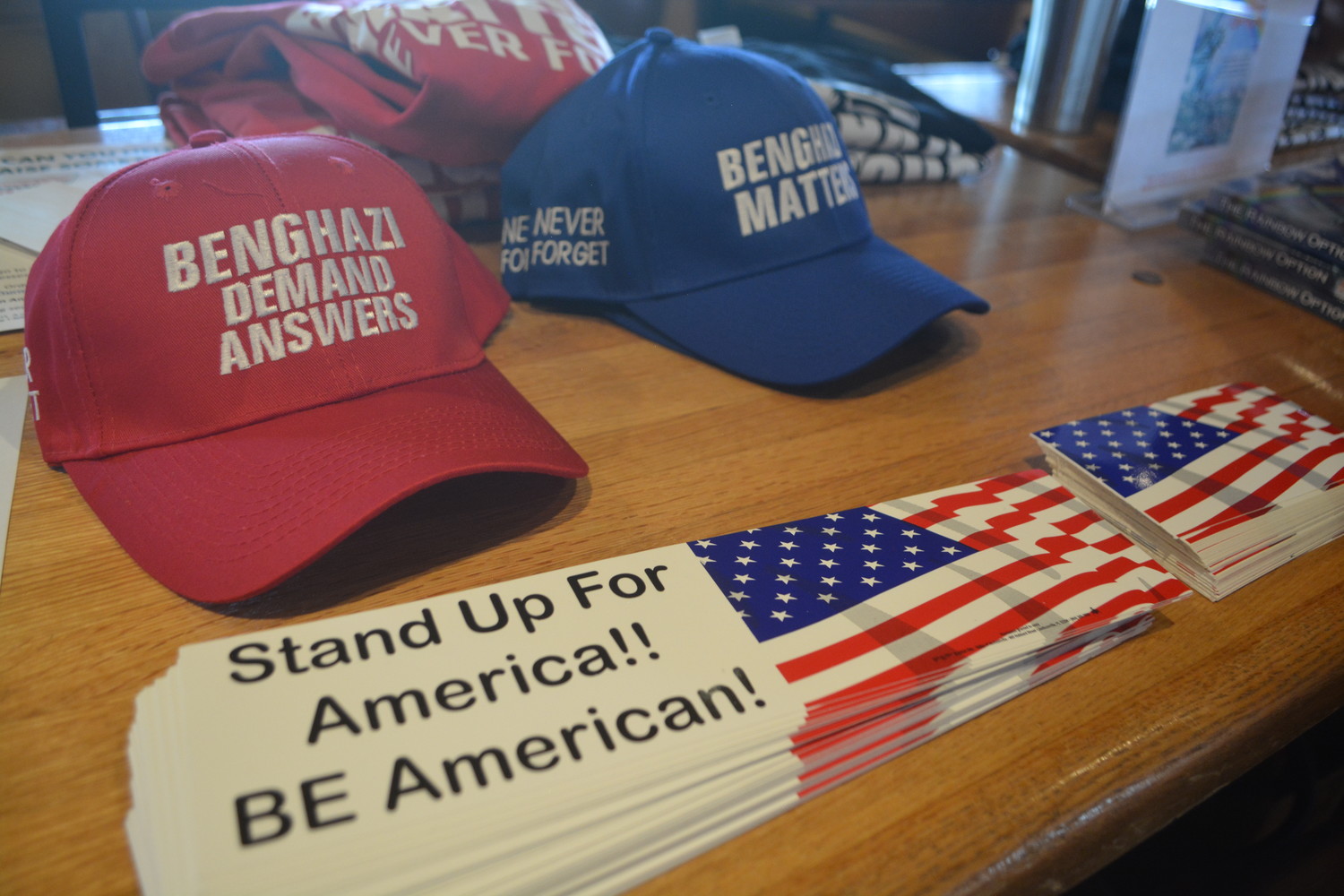 Benghazi ball caps and "Stand up for America" bumper stickers on sale at the veterans luncheon