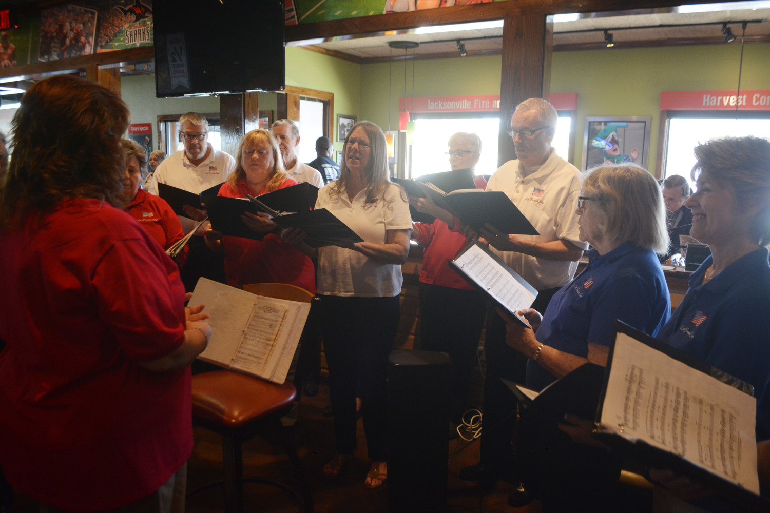 The “Let Freedom Ring Chorus” sings patriotic songs at the event.
