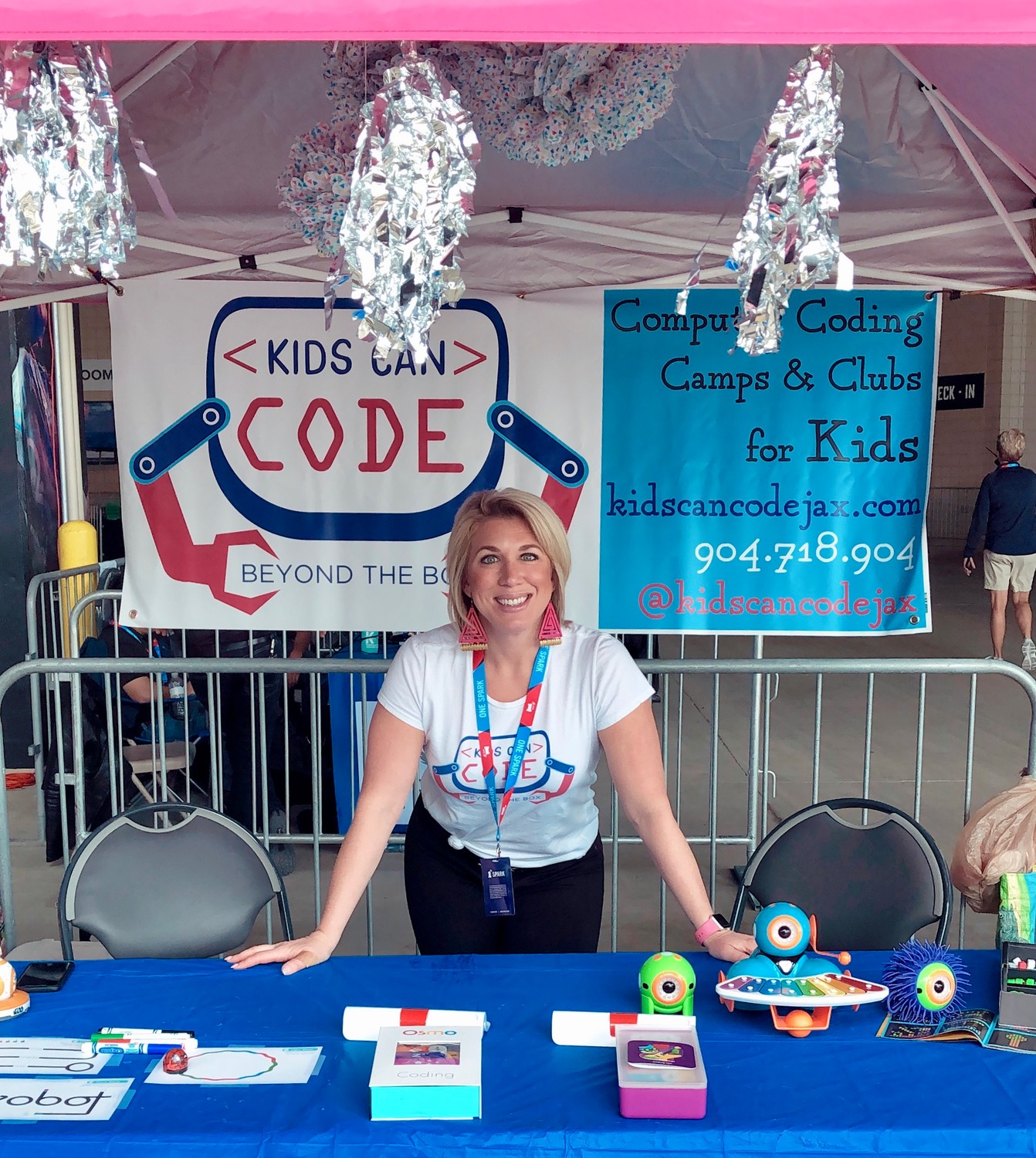 Ocean Palms Elementary School teacher Lauren Wade stands in front of her Kids Can Code booth at the One Spark idea festival at EverBank Field, where she ultimately took home third place and a $5,000 reward after competing in the Spark Tank competition.