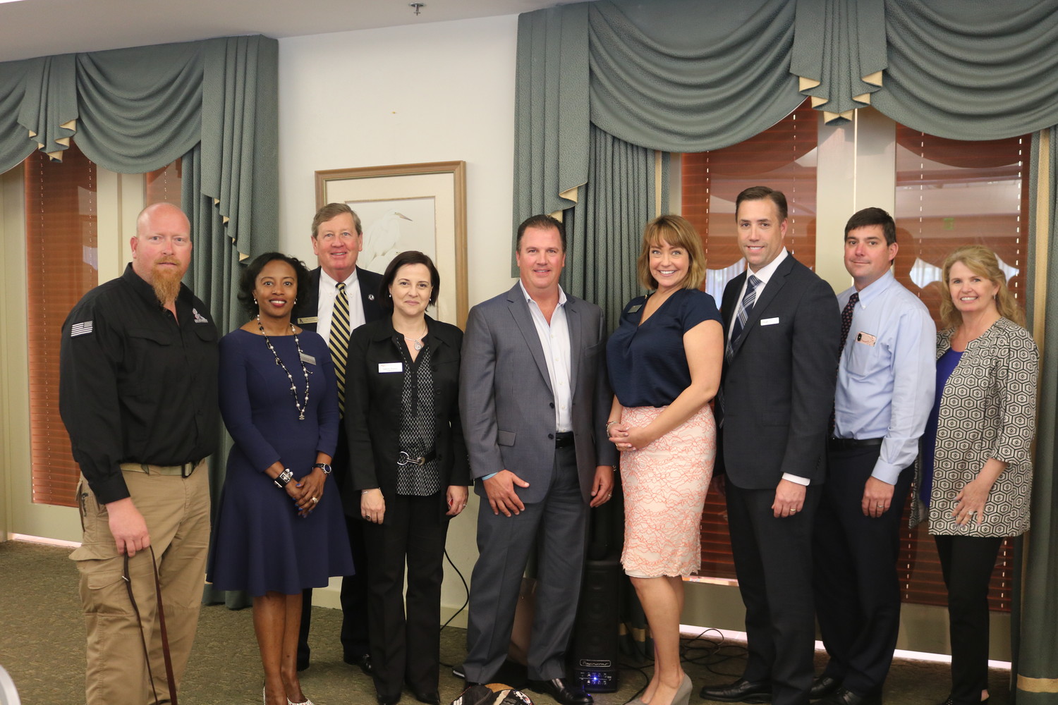 Greg Wells, Felicia Cox, Tim Crosby, Isabelle Renault, Garry Redig, Toni Boudreaux, Brian Zehren, Brandon Starks and Christine Wier gather at the joint Chamber luncheon on Thursday, April 12 at Sawgrass Country Club.