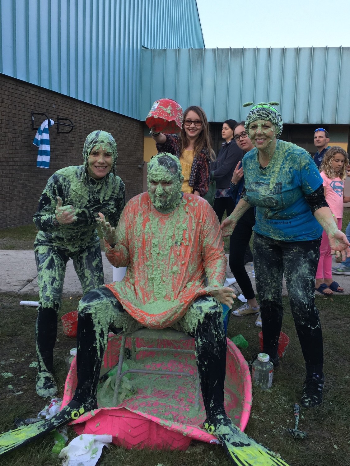 Slimeapalooza was a success at Ocean Palms Elementary Spring Family Fun Night, raising almost $700 to benefit The Giving Orchard at OPE. Students had the opportunity to purchase “slime” to pour on the school principal, Tiffany Cantwell, the assistant principal, Zach Strom, and the school secretary, Kerry Fodor. The fifth-grade Ambassadors were trying to raise money to purchase two orange trees for The Giving Orchard, exceeding their goal of $225 by almost $500.  The oranges from the Giving Orchard trees will be donated to the hungry in the community, and the remaining money will be donated to another cause voted on by the Ambassadors.