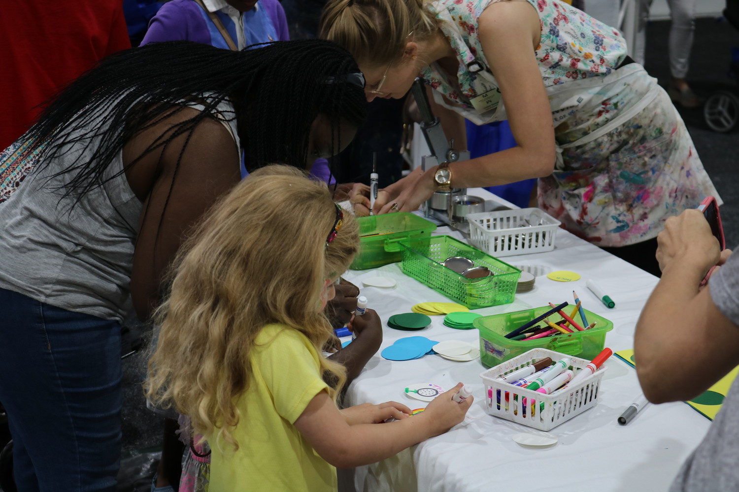 Children and some adults enjoy coloring at the Community PedsCare event.