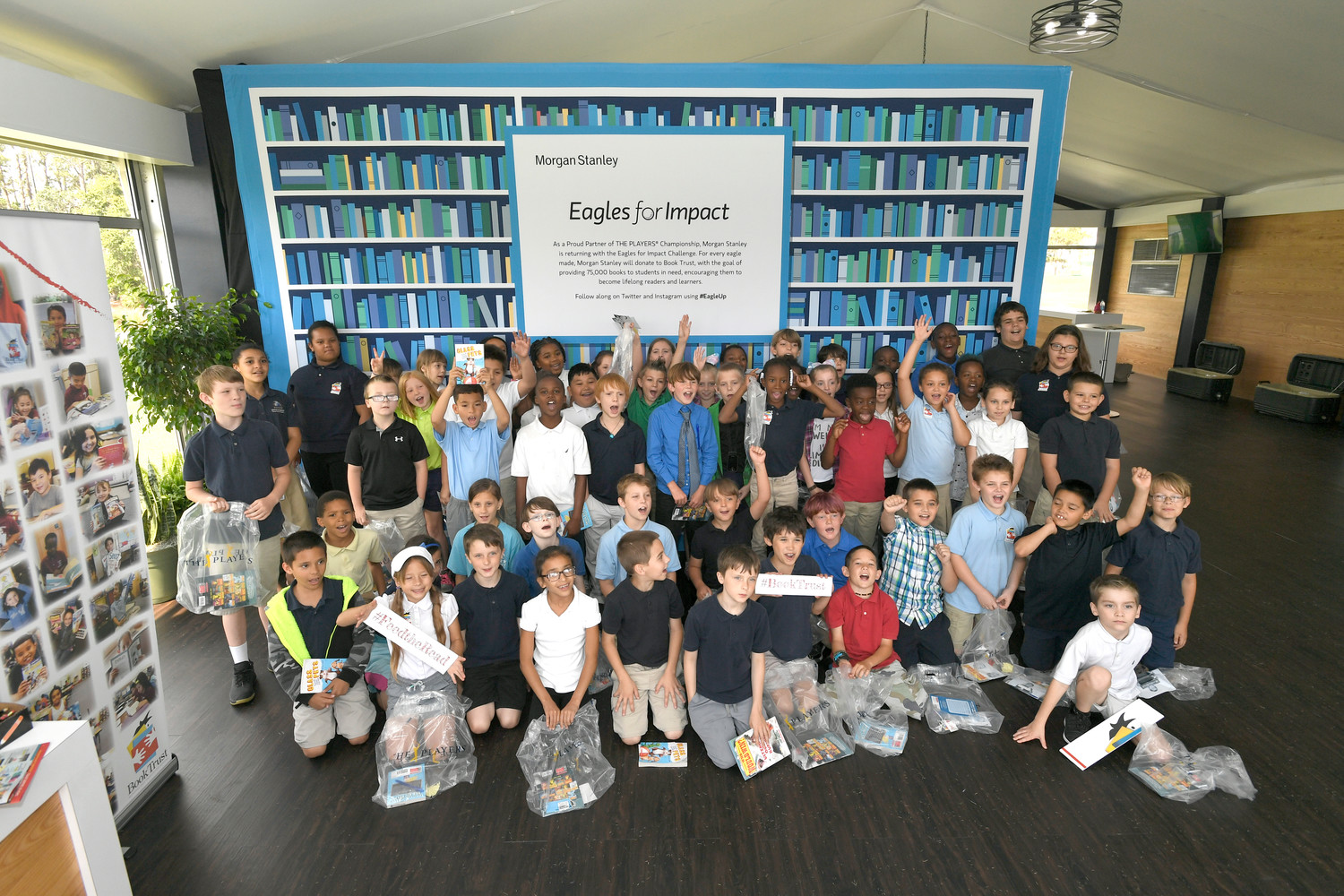 Morgan Stanley and Book Trust hosted a field trip for third-grade students from Mayport Elementary at THE PLAYERS Championship last Tuesday, May 8. During the visit, the students had a chance to participate in a book selection through Book Trust, interact with the state-of-the-art golf simulator and take a photo in the custom photo booth. Following the event, Morgan Stanley local employee volunteers joined a “Feed the Read” celebration at Mayport Elementary to deliver the books selected by the children.