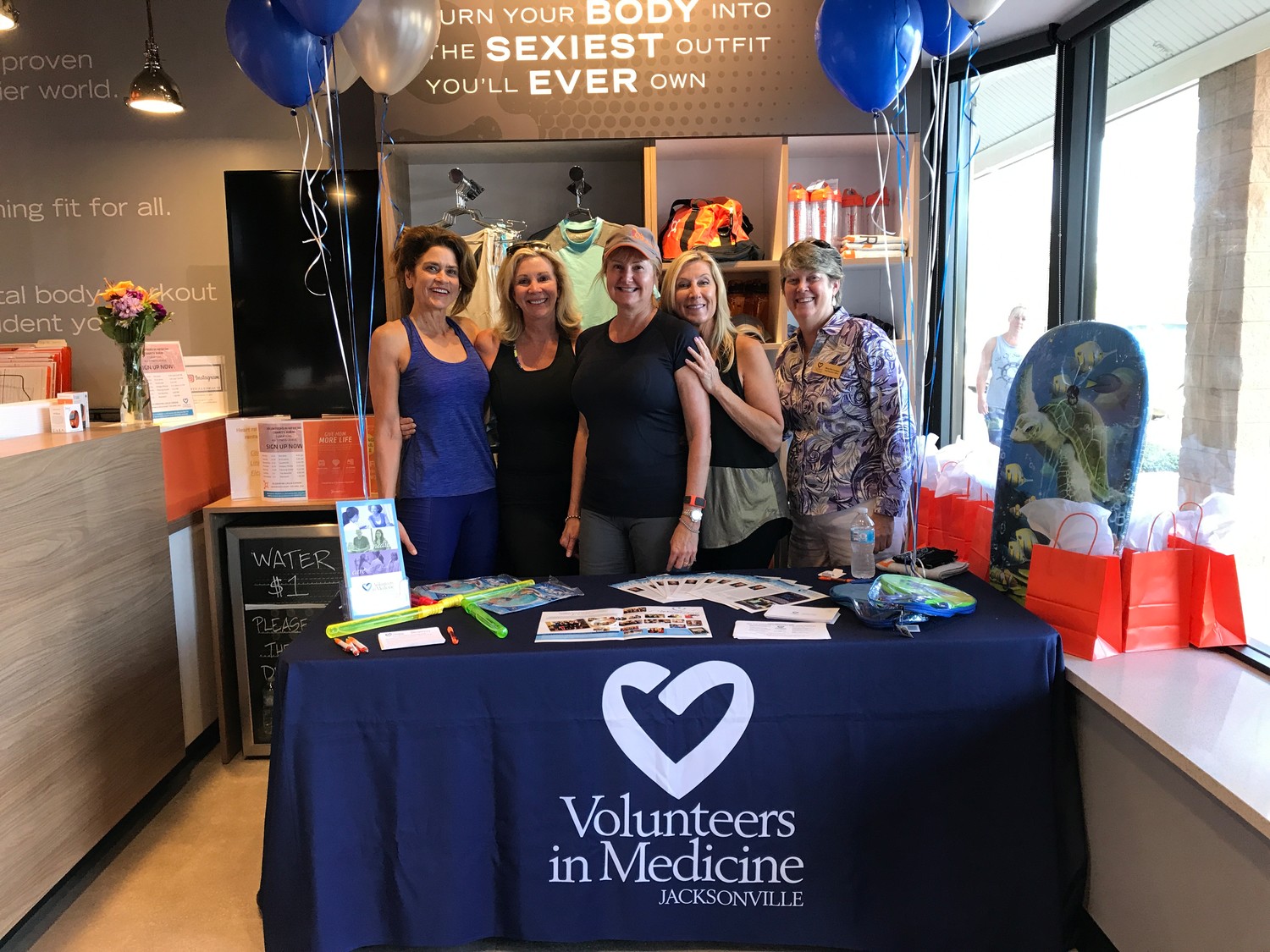 2017 Women With Heart honoree Aimee Boggs (from left); 2018 honorees Shelley Morgan, Leslie Gordon and Dany Atkinson; and Volunteers in Medicine CEO Mary Pat Corrigan attend one of the Orangetheory Fitness Charity Burn events.