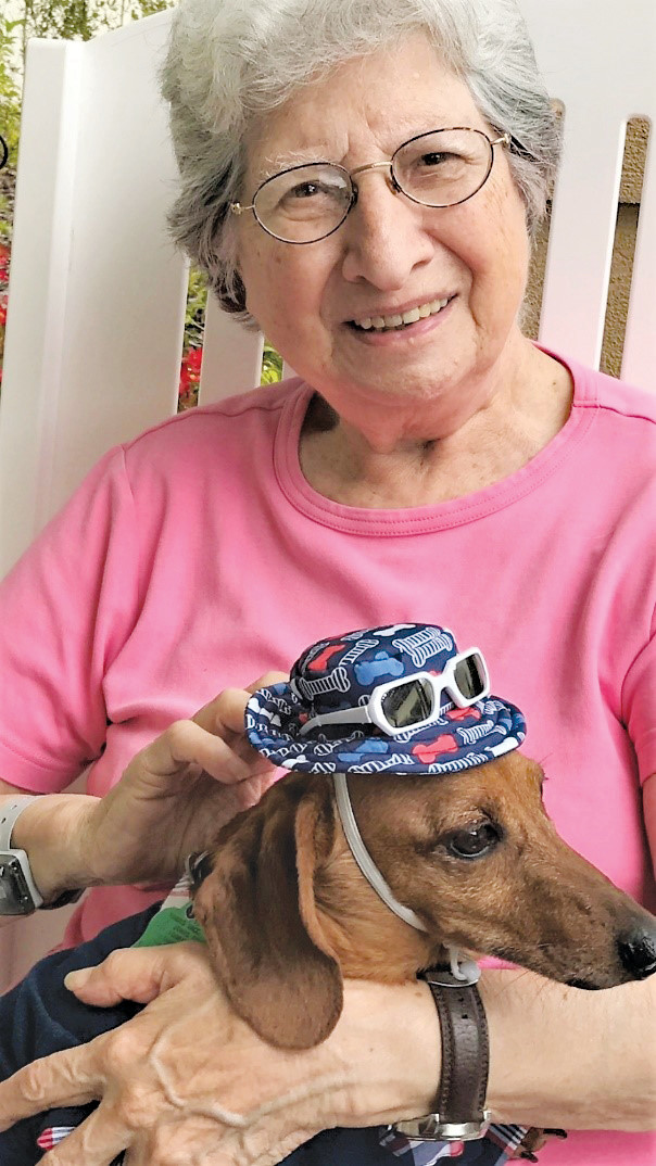 A Silver Creek resident snuggles with a rescue dog named Chevy. Others will have similar opportunities July 26 when Silver Creek hosts its “Yappy Hour” adoption event in partnership with S.A.F.E. Pet Rescue.