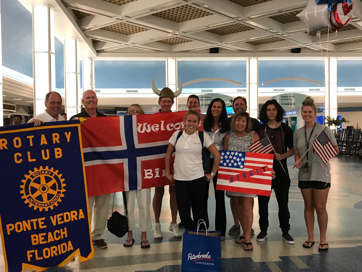 Members of the Rotary Club of Ponte Vedra Beach welcome Youth Exchange Students Zed and Birgit at the Jacksonville International Airport last week. Zed, who is from Hungary, and Birgit, who is from Norway, will be spending the next academic year in the U.S. as participants of the Rotary Youth Exchange Scholarship Program.