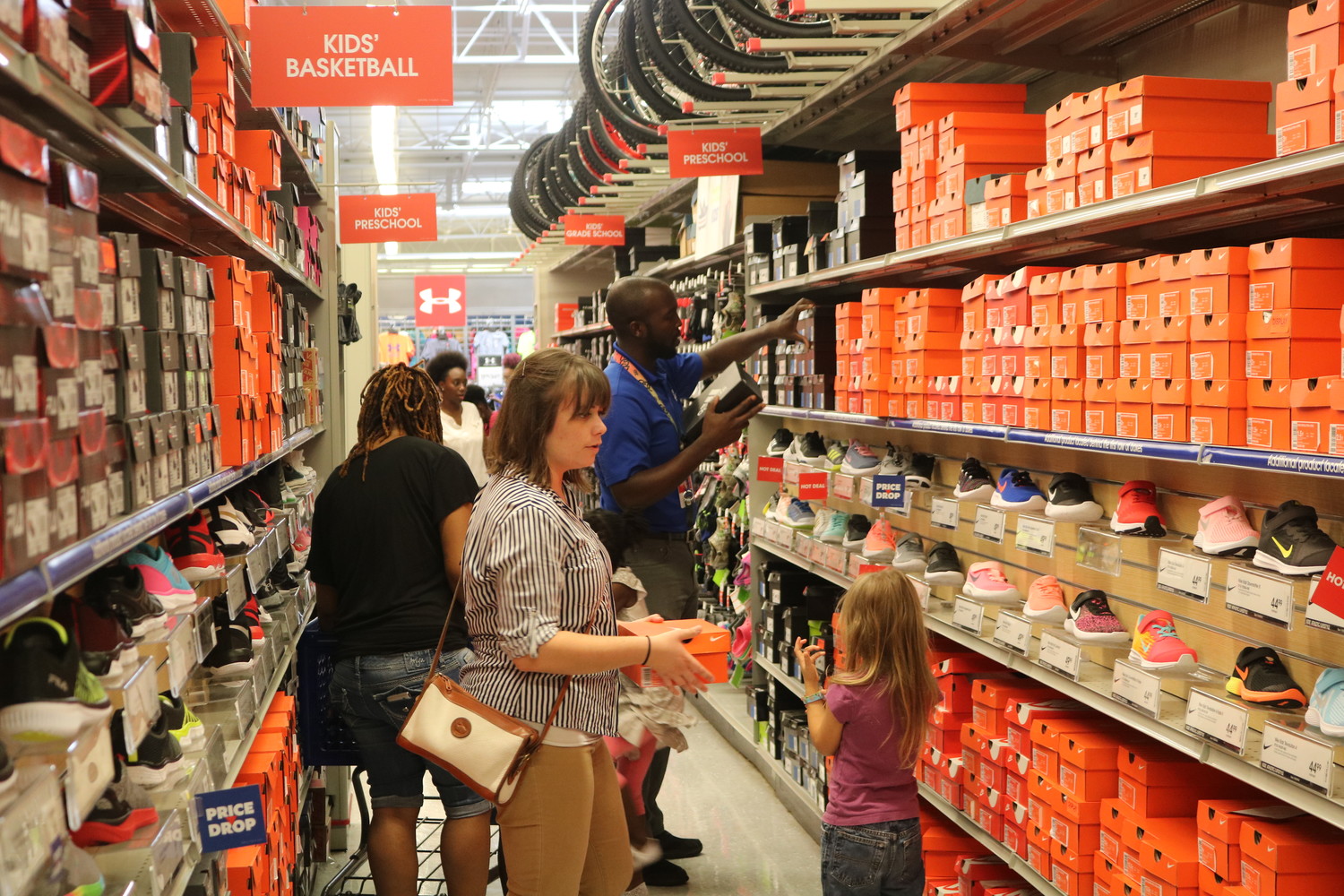Children shop for shoes at McCray's back-to-school event.