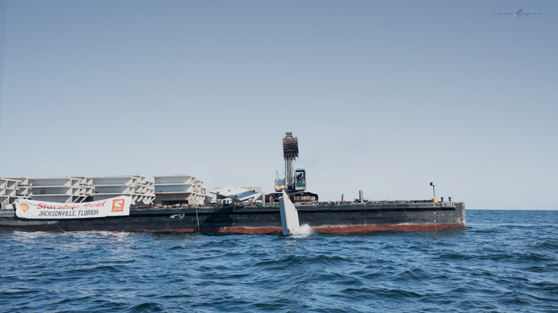 A ship deploys the concrete structures necessary to construct the Coastal Conservation Association / Building Conservation Trust Starship Reef Project.