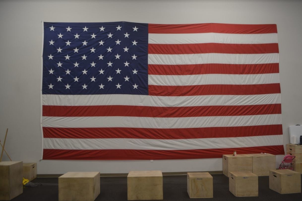 The fitness area features a patriotic display.