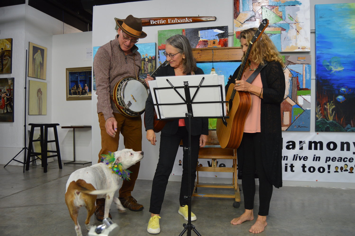 The band Skin & Bonz turned a poem by Chris Bodor into a song and performed it in a video featuring "Molly," the inspiration for smiling dog in the corresponding painting by Laura O'Neal.