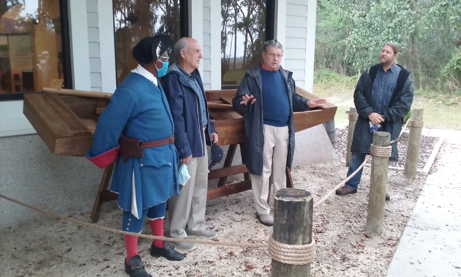 Standing in front of the barca chata are, from left, Fort Mose Historical Society President Charles E. Ellis, boat builders Gene Veltri and Steve McMullen, and archaeologist Chuck Meide.