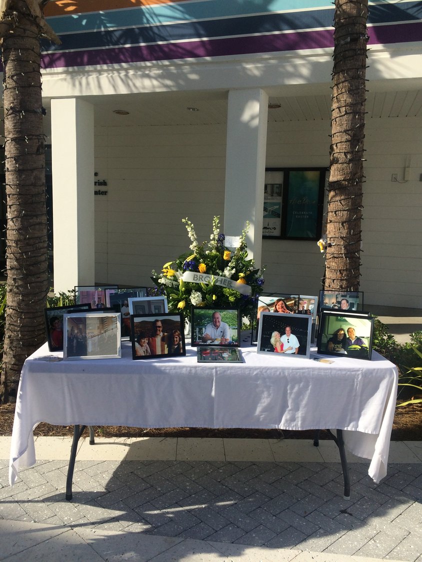 A tribute table is shown outside Christ Episcopal Church during services for the late David Danzeisen.