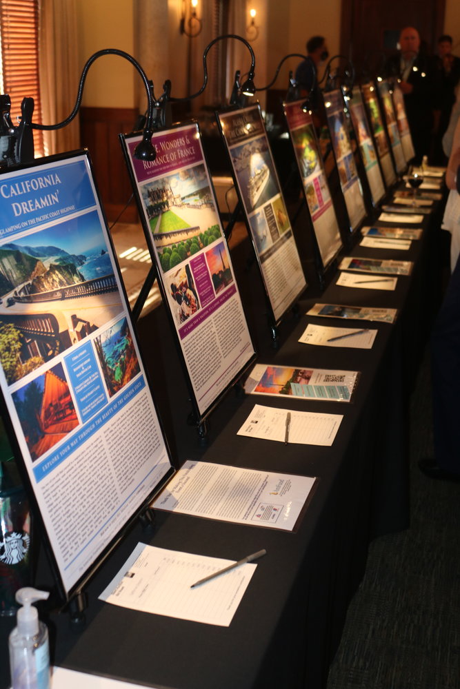 A table at Beaches, A Celebration of the Arts displays silent auction items.