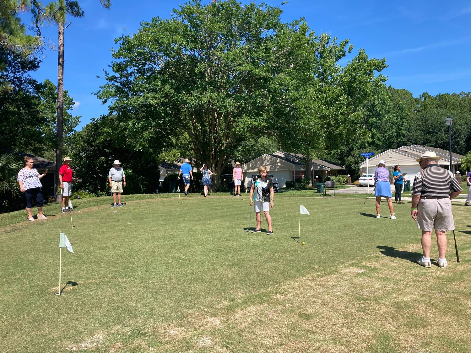 Putters compete in the fourth annual Putters Tournament at Cypress Village on June 11.