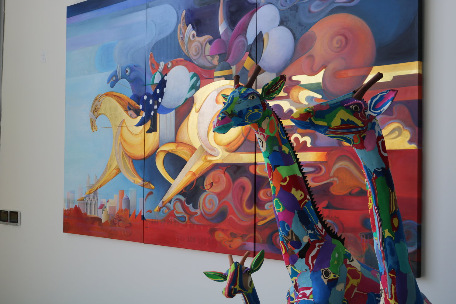 The link showcases the work of some of the area’s most accomplished artists. The giraffes are part of a menagerie of animals created by Ocean Sole from recycled flip-flops. The painting is by Susanne Schuenke.