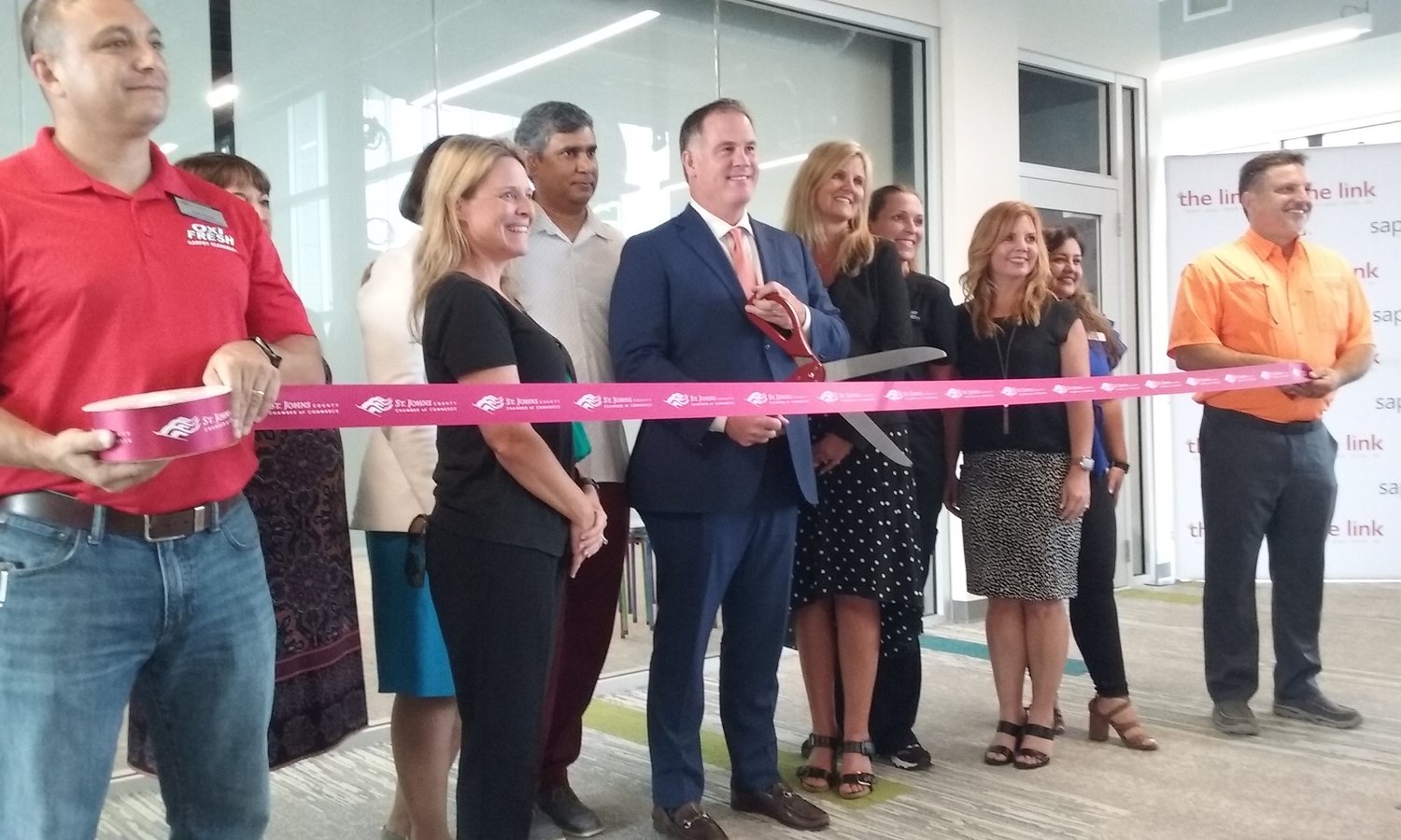 Flagler Health+ President and CEO Jason Barrett cuts the ribbon on the Flagler Health+ Immersive Studio during grand opening festivities for the link on Wednesday, July 14.