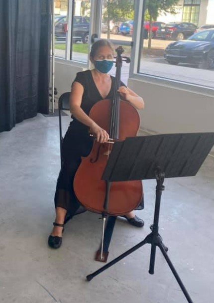 Sabrina Krisberg gives a cello performance during the Cultural Center’s ‘Grand Opening of the Arts’ at the link on Thursday, July 15.
