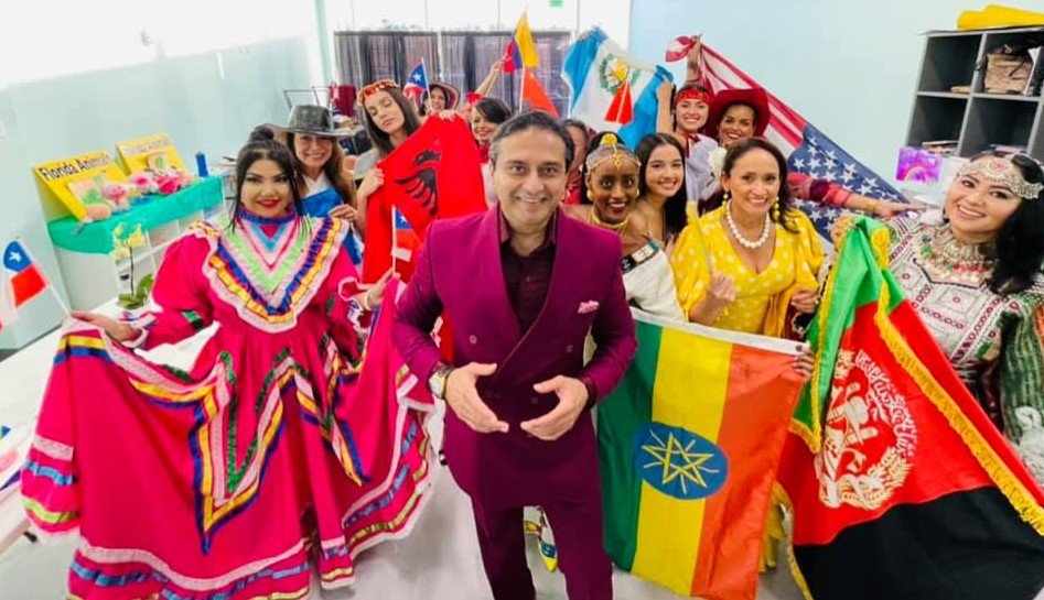 Dr. Arun Gulani poses with his models for the international fashion show he curated at the Cultural Center’s ‘Grand Opening of the Arts’ at the link on Thursday, July 15.