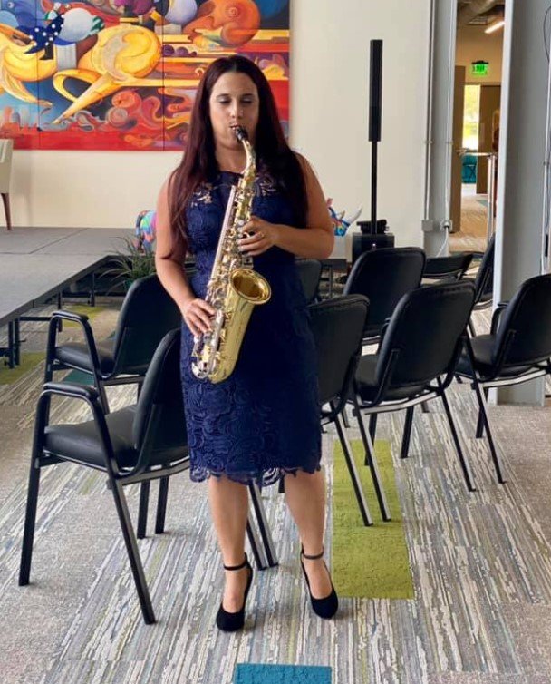 Maura Delgado performs a saxophone solo during the Cultural Center’s ‘Grand Opening of the Arts’ at the link on Thursday, July 15.