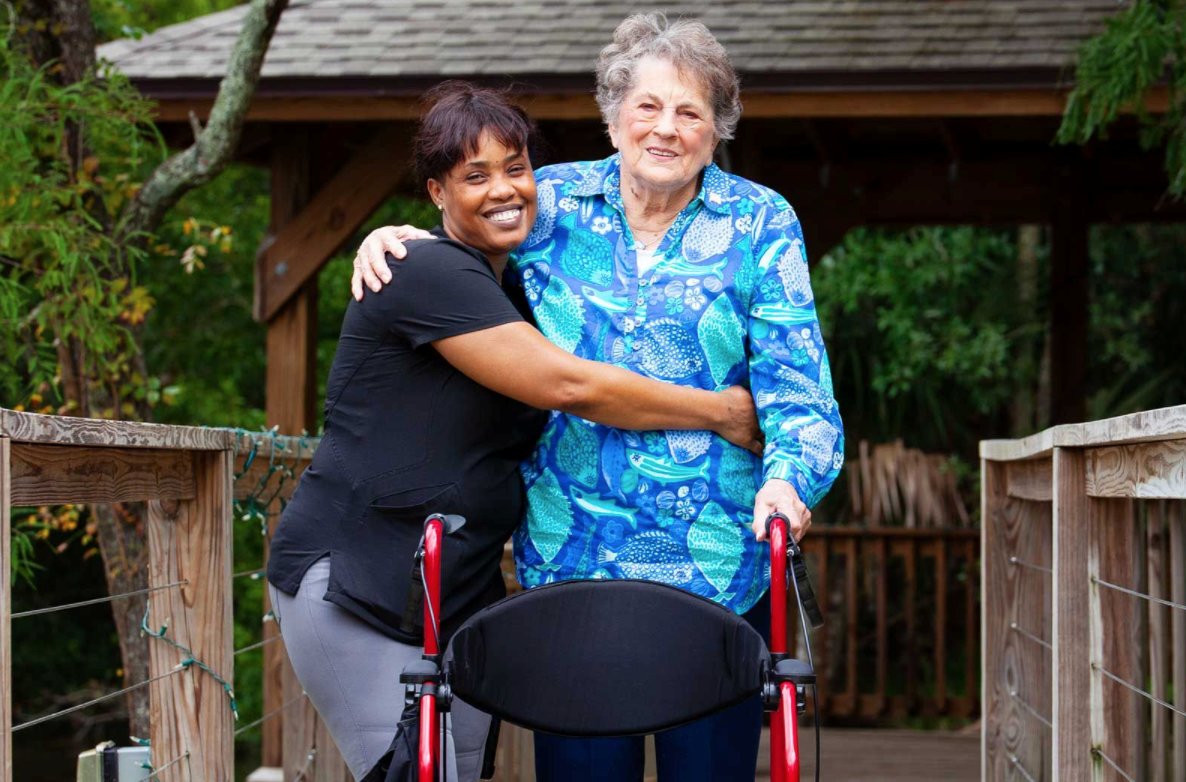 A Starling team member and resident are seen at the senior living community.