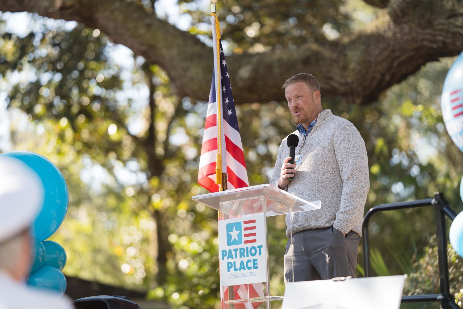Michael Arnold, a veteran of the U.S. Army and employee of Flagler Health+, speaks at the Nov. 16 flag-raising at Patriot Place.