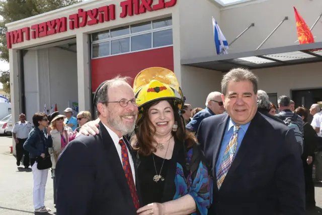 Stephen and Penny Rosen with JNF-USA CEO Russell F. Robinson, from left, attend the 2019 dedication of the fire station.