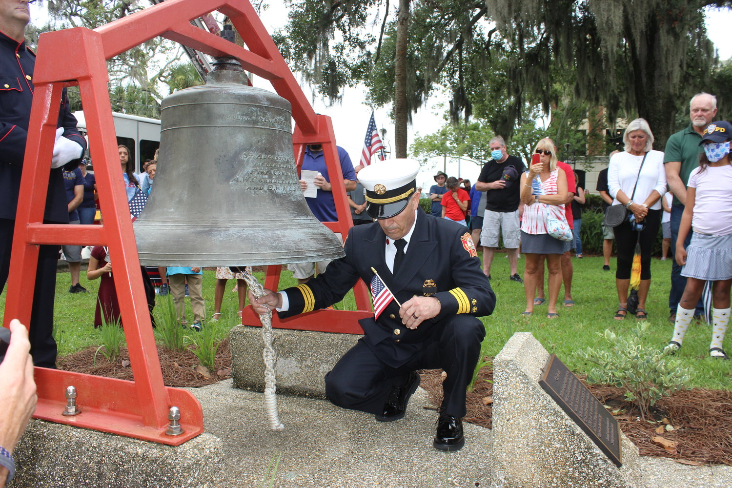 At the conclusion of the 9/11 memorial service in St. Augustine, Fire Department Safety Chief and Fire Marshal Bob Growick rings the historic 1900 service fire bell at four intervals of five rings each.  The tradition of 