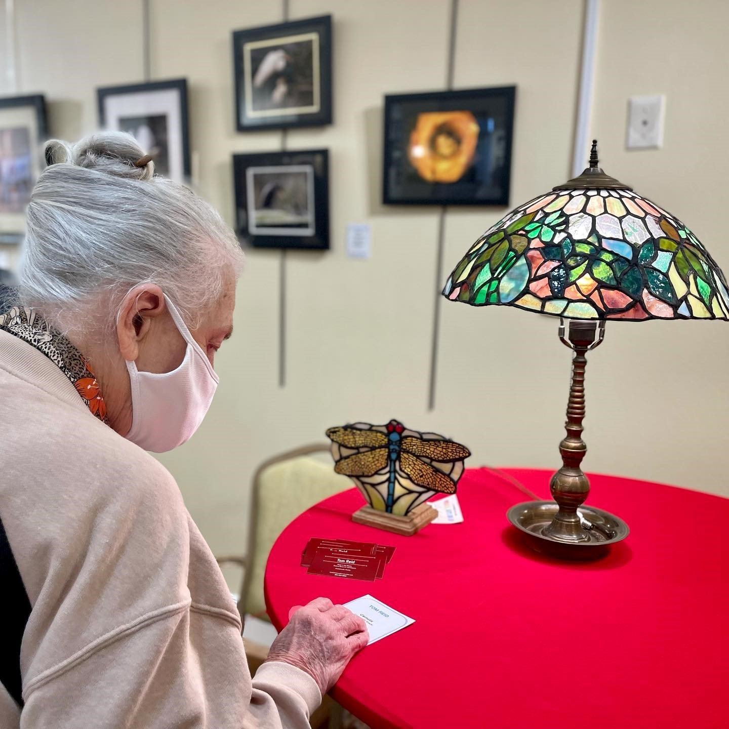 Tom Reid’s colored-glass lampshade and dragonfly were popular with visitors to Cypress Village’s Visual Arts Show.