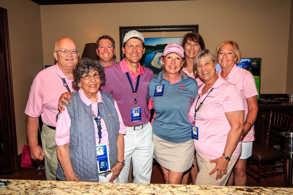 The 2015 TPC Chair Brian Franco and TPC Player Services Chair Clare Berry stand in the middle of the volunteer group.